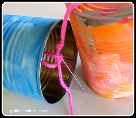 painted tin cans for clanking wind chime preschool activity