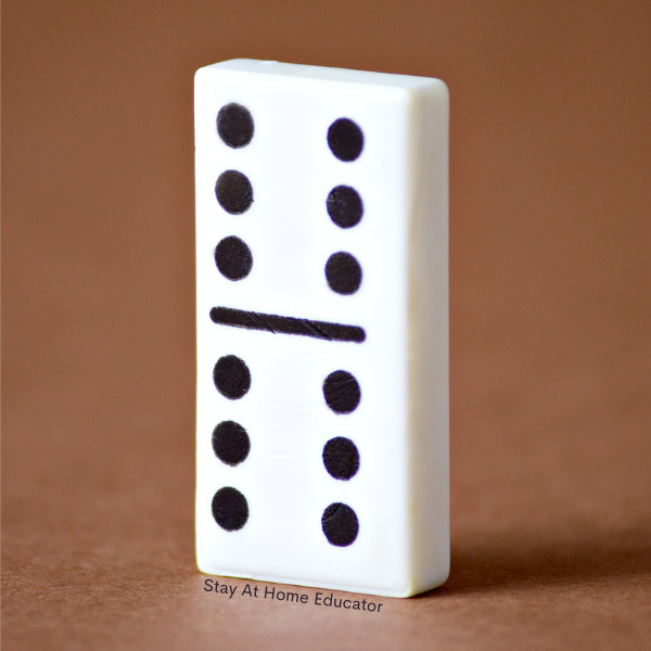 a domino standing on end with both sides showing the number six