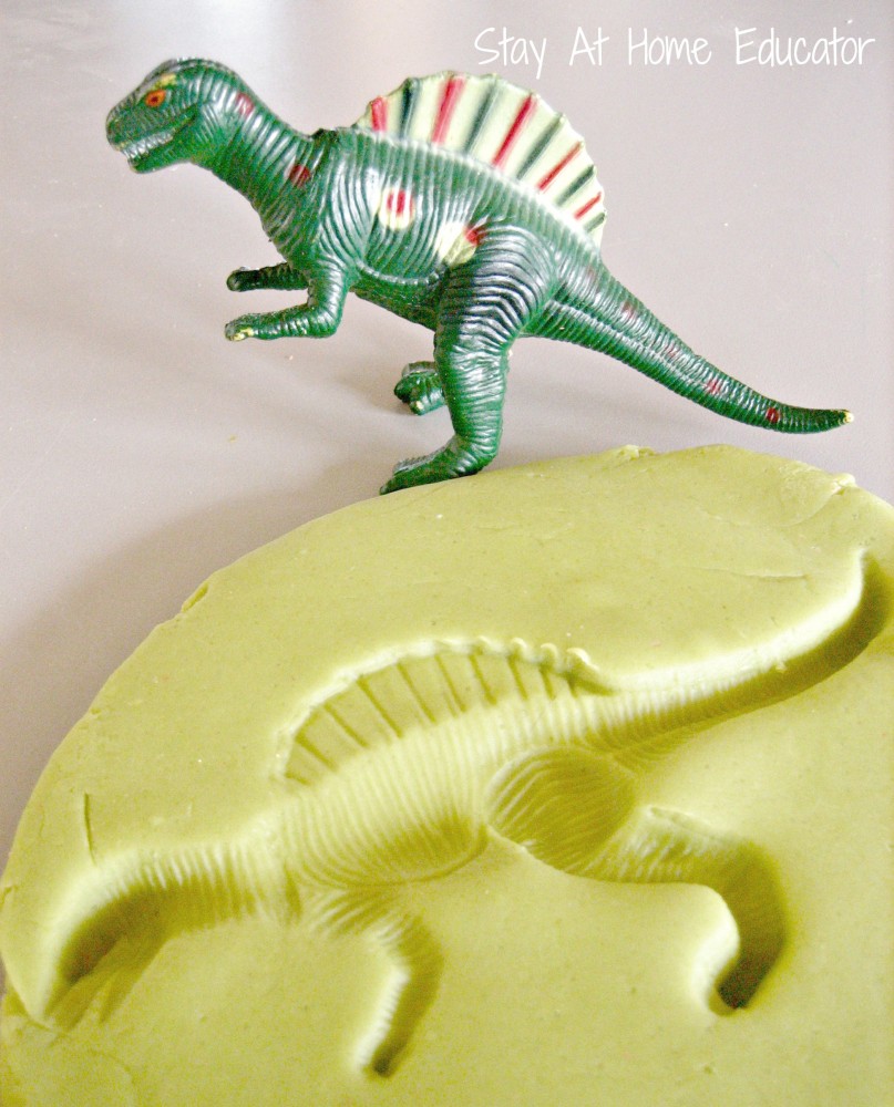 Dinosaur fossils in play dough - Stay At Home Educator