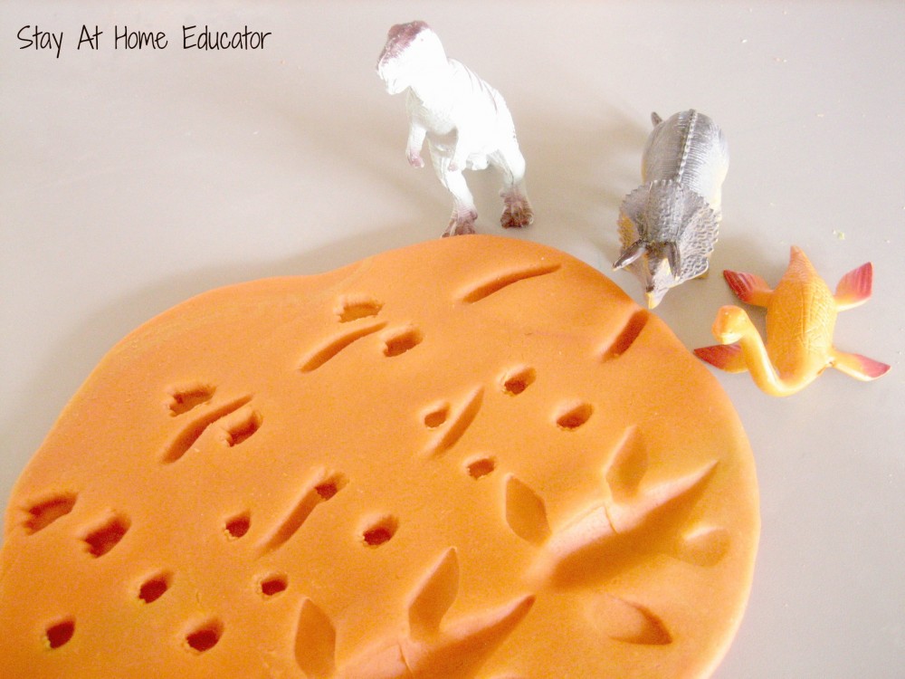 Dinosaur tracks in play dough - Stay At Home Educator