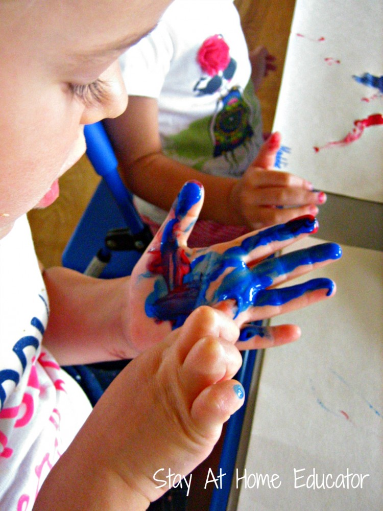 mixing colors with finger paints - Stay At Home Educator