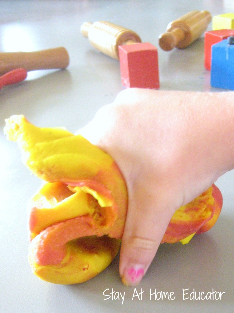 using primary colors to mix play dough into new colors - Stay At Home Educator