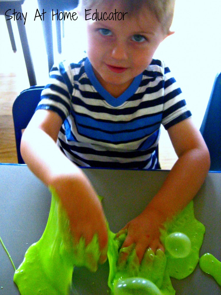 Making bubbles with slime in preschool - Stay At Home Educator