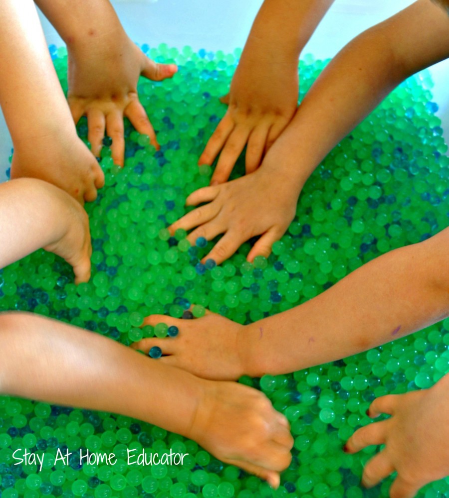 Exploring the sense of touch with wet, slippery, slimy water beads - Stay At Home Educator
