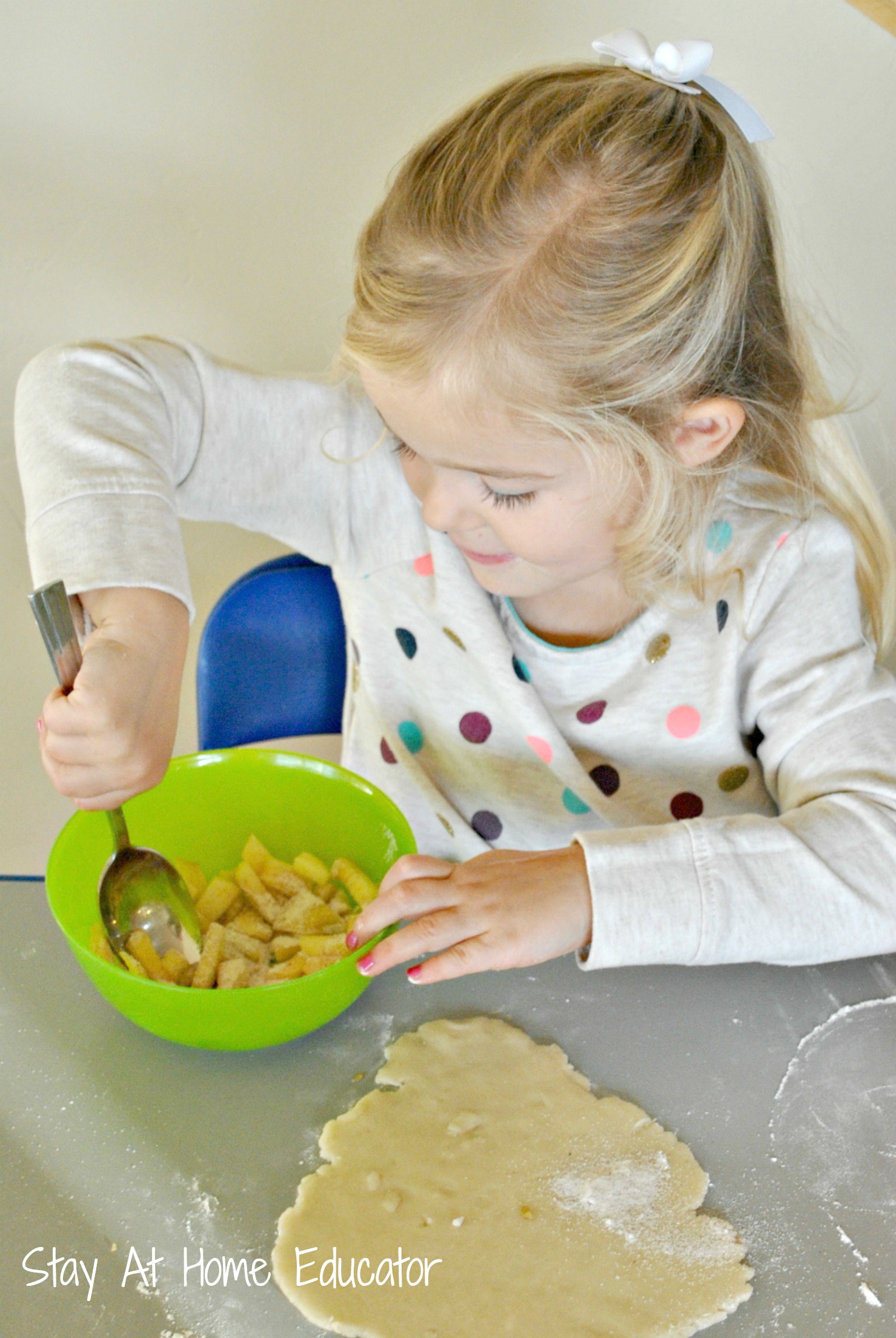 Stirring apple pie filling in preschool - Stay At Home Educator