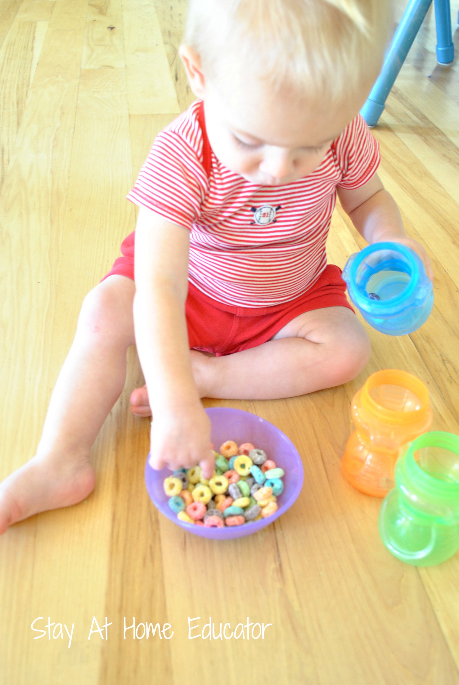 fine motor activity for babies using o shaped cereal - Stay At Home Educator