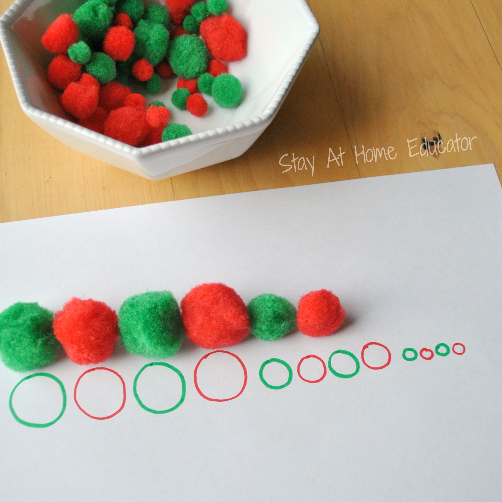 different sized pom poms are used when exploring how to teach measurement to preschoolers