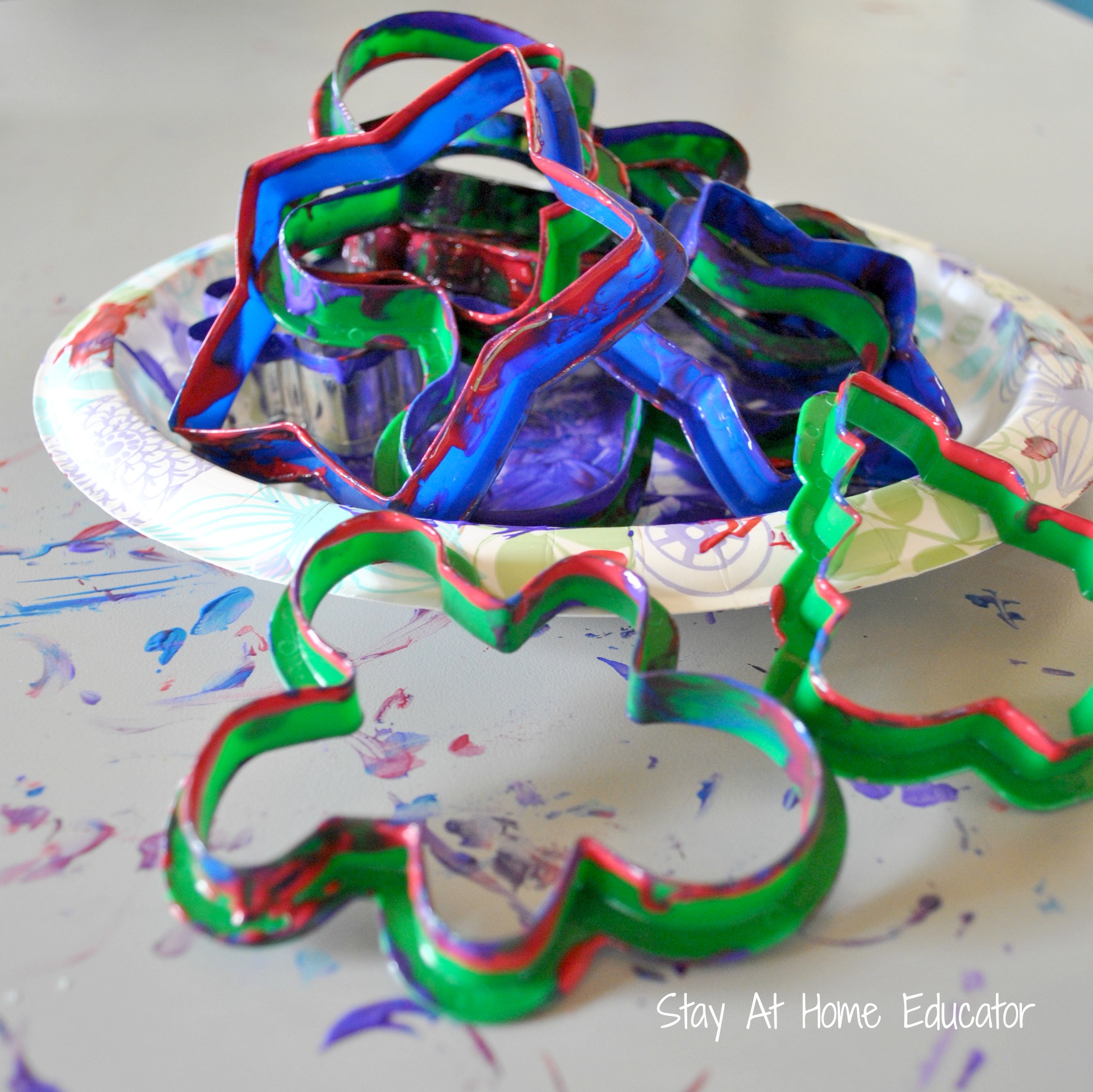 Use cookie cutters to make print art - Stay At Home Educator