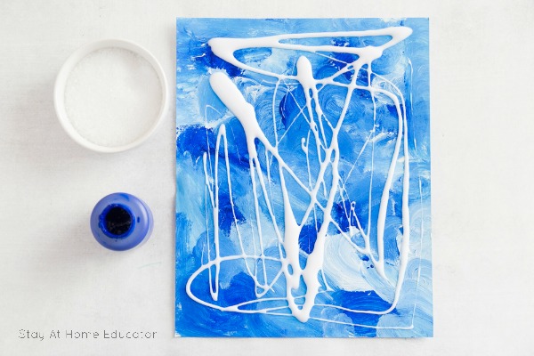 Sparkly Winter Process Art for Preschoolers - Process art is more about the process than the product, but this winter process art project for kids gives gorgeous results along with hand strengthening exercises - it's a win-win! This winter art project is great for all ages!