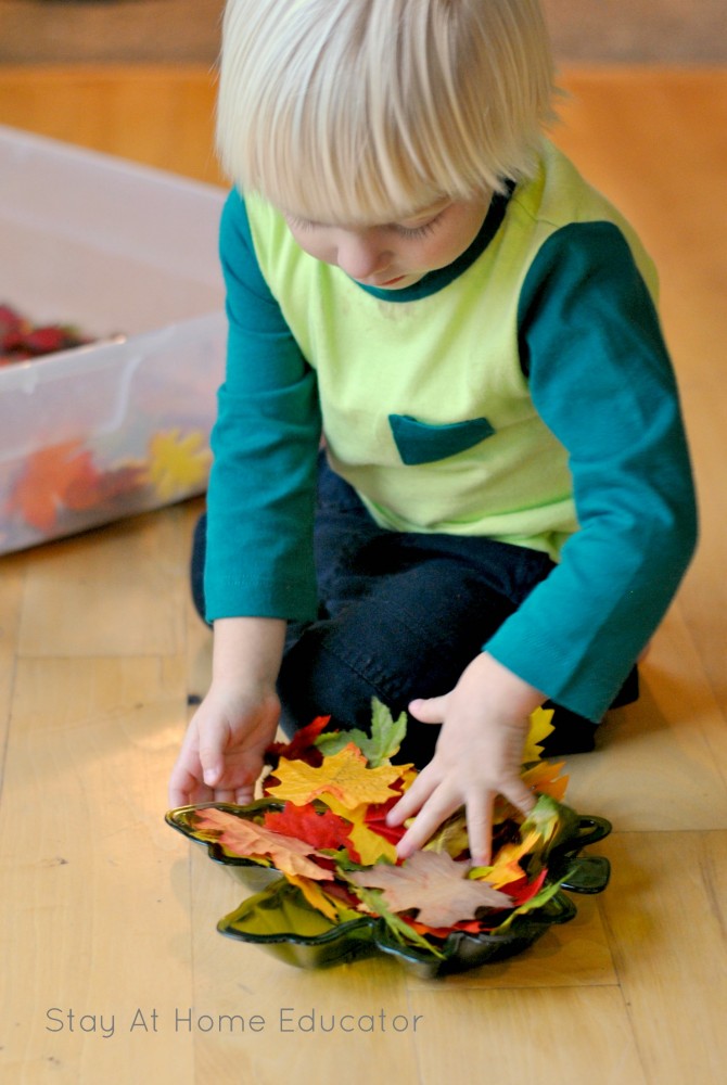 A silk leaf sensory bin is great for toddlers!