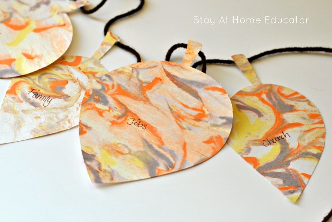 Teach preschoolers to give show thanks with this graditude leaf garland activity.