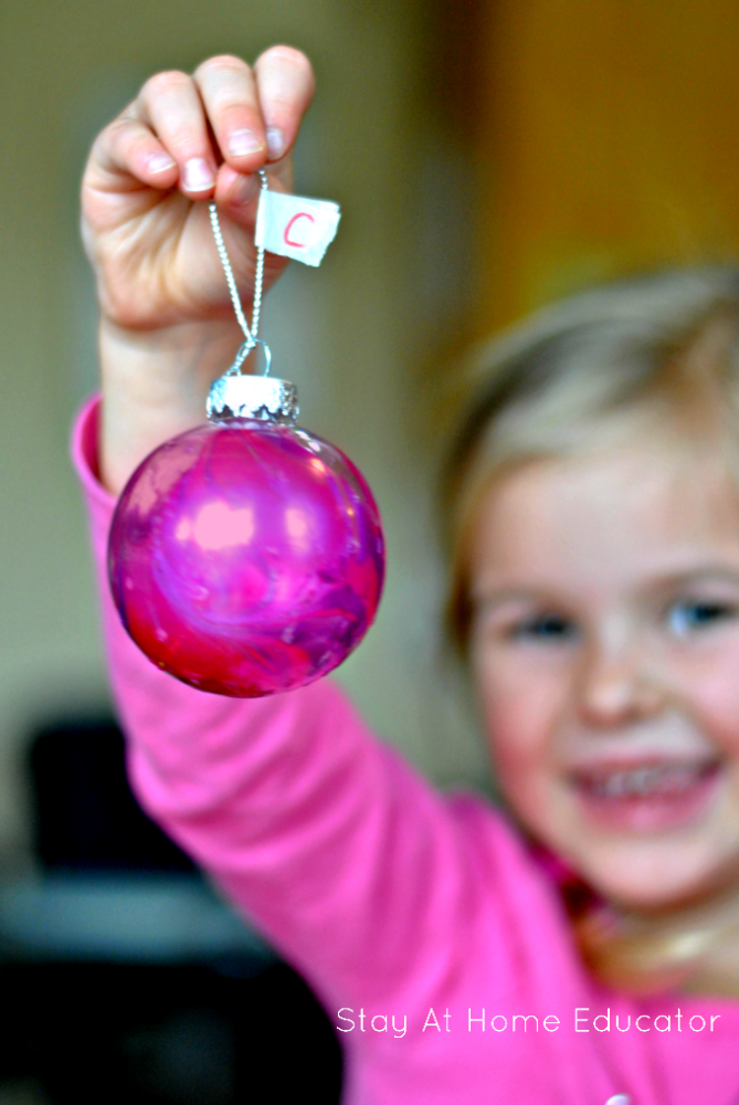 Watercolor ornaments are easy for kids to make and make the perfetc gifts for grandparents!