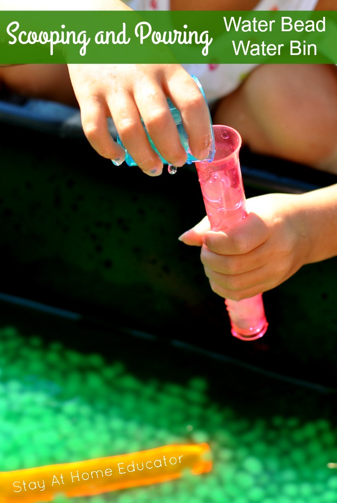 scooping and pouring water bin for summer sensory play