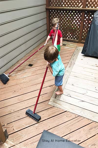 chores for preschoolers - sweeping the deck
