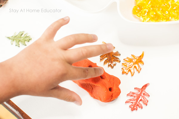 Counting holes in playdough- fall playdough invitation to play