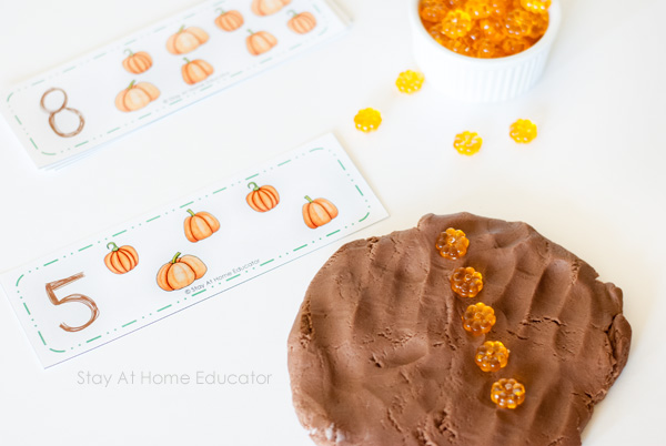 Pair the free pumpkin counting cards with acrylic pumpkins and playdough
