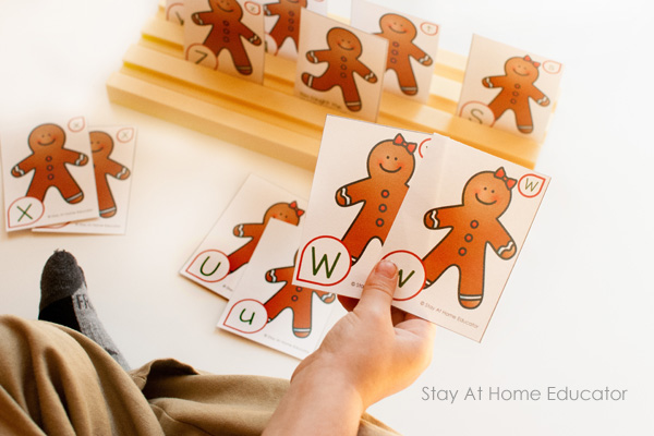 Child playing gingerbread man theme card game