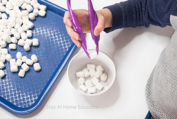 child using marshmallows for winter counting activities