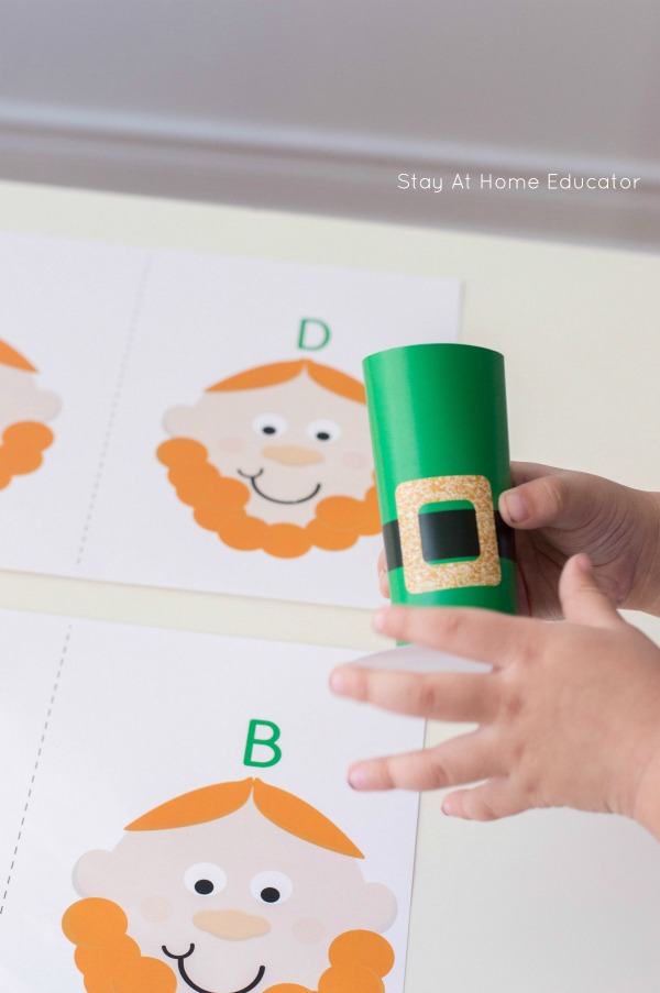 child interacting with a leprechaun printable alphabet game