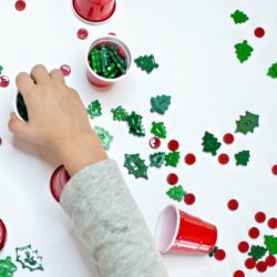Christmas STEM Activities for Preschool | using buttons, confetti, plastic cups to create STEM opportunities and challenge thinking skills |
