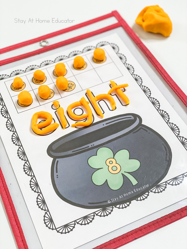 counting mat number 8 with play dough balls and the number word eight rolled in playdough | counting mats for numbers to 10 | printable St. Patrick's day activities