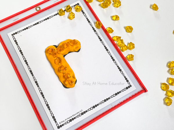 Building letters with fine motor mats - St. Patrick's Day literacy activities for preschoolers, St. Patrick's Day letter matching, beginning sounds, and phonological awareness