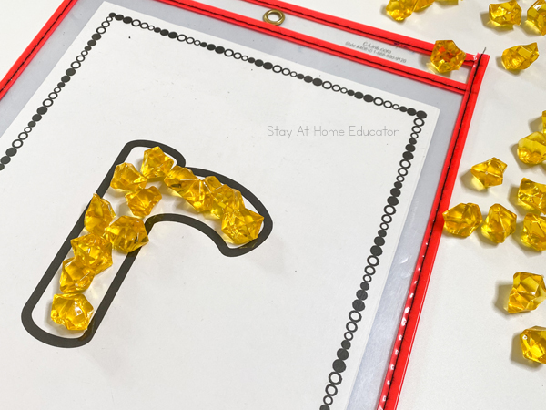 Building letters with fine motor mats - St. Patrick's Day literacy activities for preschoolers, St. Patrick's Day letter matching, beginning sounds, and phonological awareness