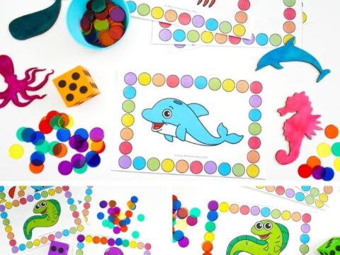 Roll and cover activity featuring fish, crabs, and seahorses for math fun.