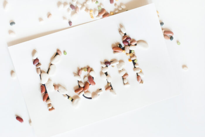 a completed name activity for preschoolers with the name Kent totally covered in seeds 