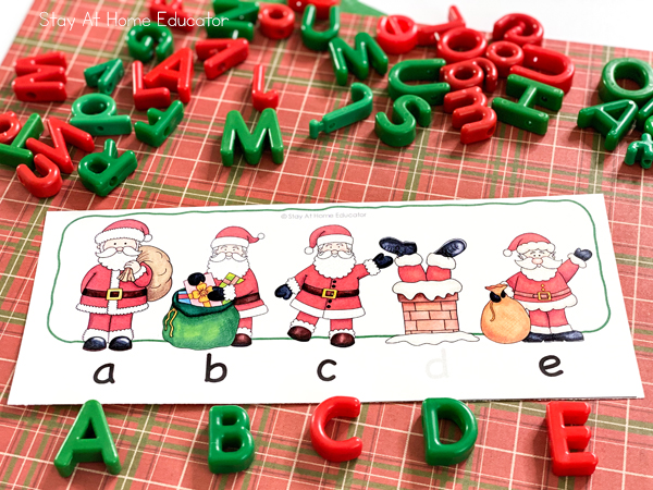 uppercase alphabet manipulatives matching their lowercase counterparts that are printed on christmas themed alphabetical order cards