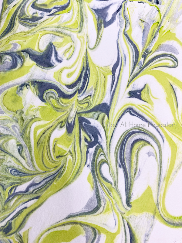 a gorgeous marbled pattern left behind on cardstock that will make shaving cream marbled christmas trees