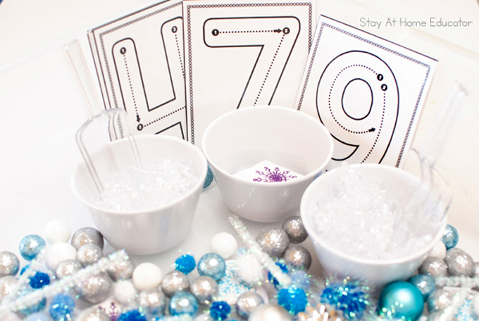 laminated number cards add a math component to winter sensory play