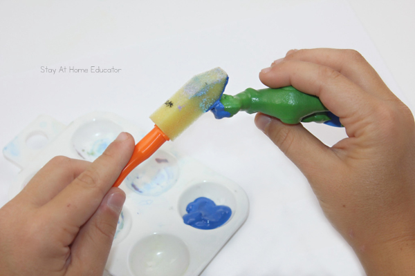 a green toy dinosaur is being painted blue during fun dino activities