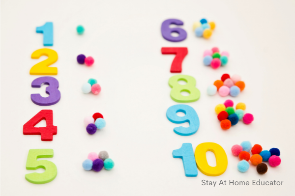 the numbers one to ten with the correct amount of pom poms next to it showing one to one correspondence