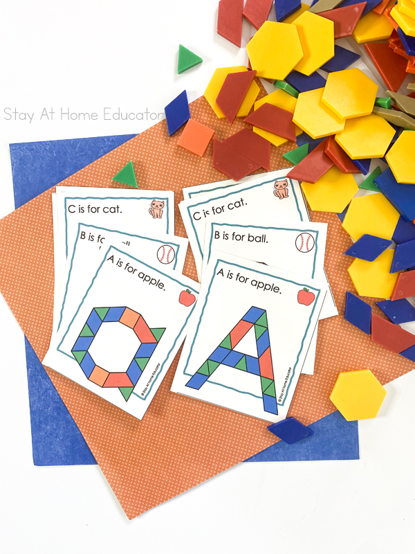 alphabet pattern blocks printable task cards| alphabet pattern block mats | task card with lowercase a and task card with capital A, both with sentence A is for apple and apple picture on top| Shows partial task cards with sentences and images: B is for ball. and C is for cat.| assorted pattern blocks next to task cards