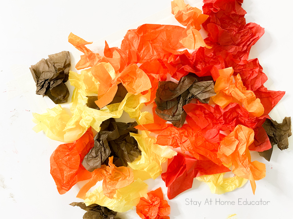 fall art ideas |toddler process art ideas | toddler fall activities | fall process art for preschoolers | full page of tissue paper on artwork