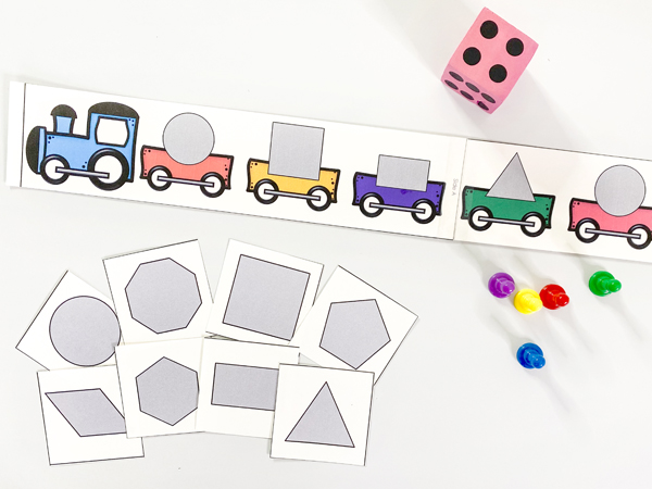 This shape train game is included in the shapes lesson plans for preschool. It can be found in the daily lesson in shapes math curriculum. It invites children to identify shapes, practice counting, and learn to play cooperatively.