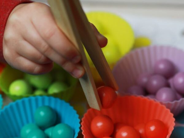 This ultimate guide to developing fine motor preschool skills is full of activity ideas, plus includes background information on why fine motor skills are important and how to best help develop them.