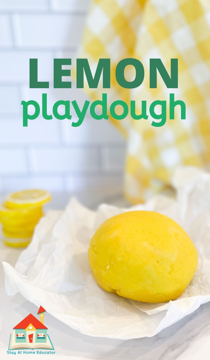 ball of lemon playdough on parchment paper using classic cooked playdough recipe | lemonade playdough with lemon juice