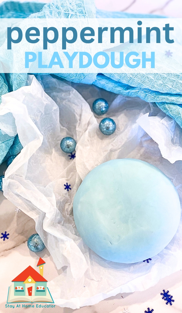 best peppermint playdough recipe | how to make peppermint playdough | ball of peppermint playdough on parchment paper with blue cloth