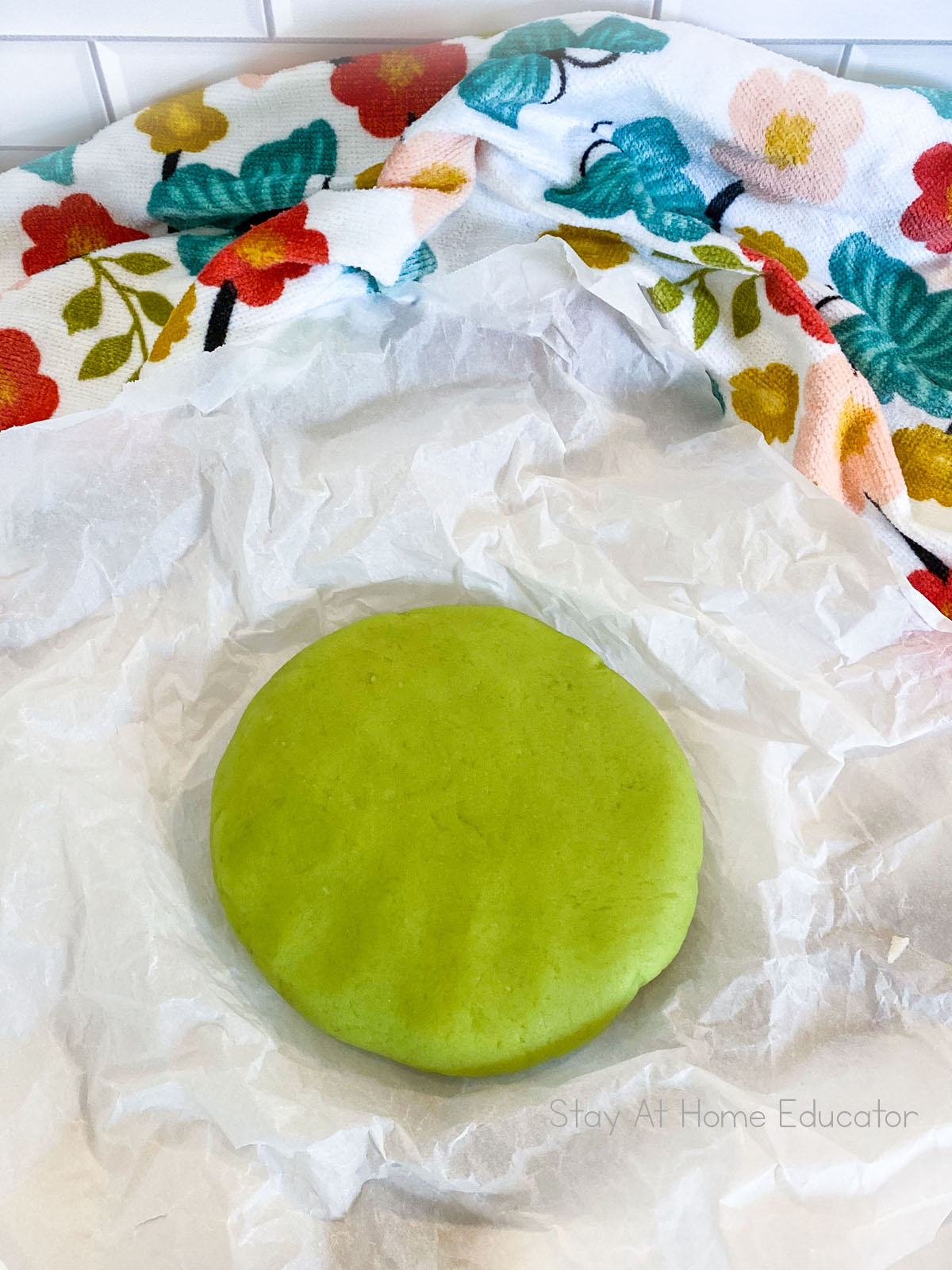 Cooked playdough recipe with cream of tartar. Playdough on crumbled parchment paper.
