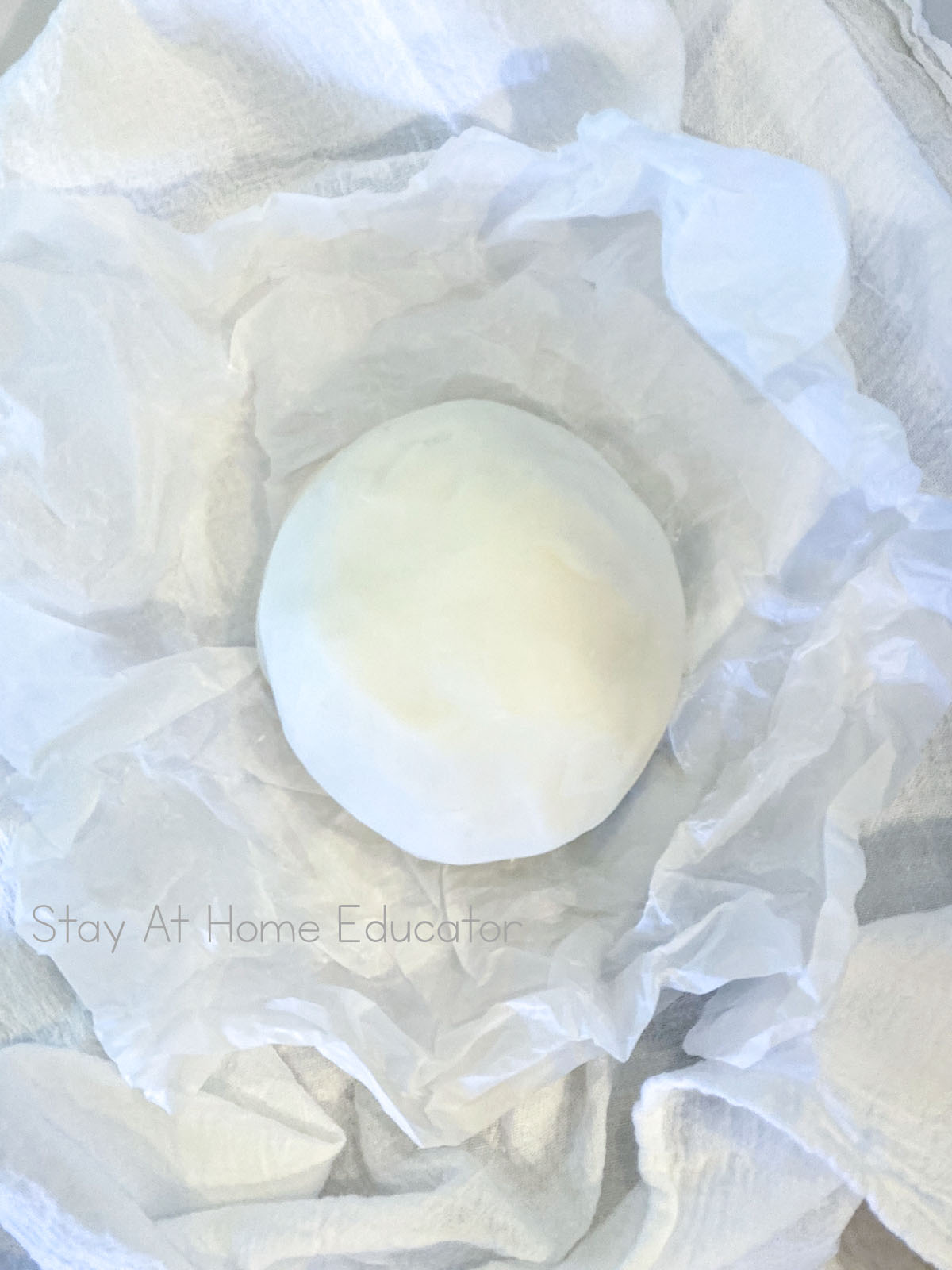 how to make white playdough | white playdough recipe without cream of tartar | ball of white playdough on parchment paper