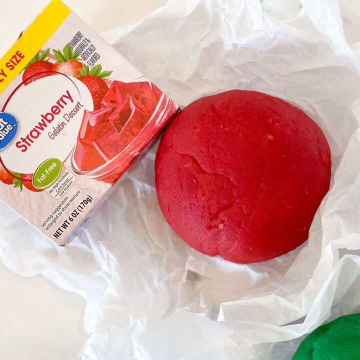 jello playdough recipe | red playdough on parchment paper with flavored gelatin | easy recipe for jello playdough