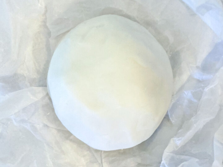 how to make white playdough | white playdough recipe without cream of tartar | ball of white playdough on crumpled parchment paper