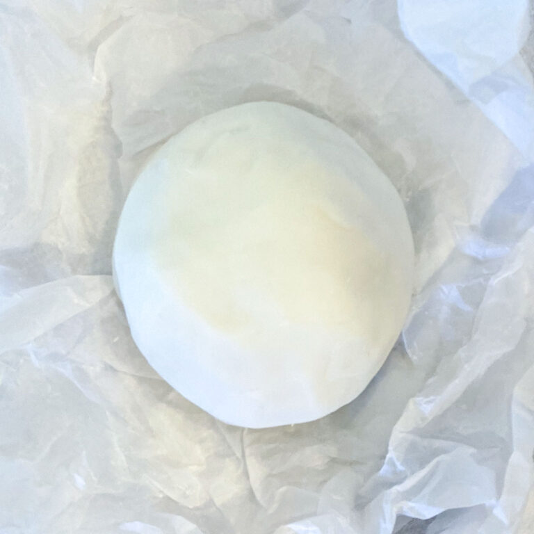 how to make white playdough | white playdough recipe without cream of tartar | ball of white playdough on crumpled parchment paper