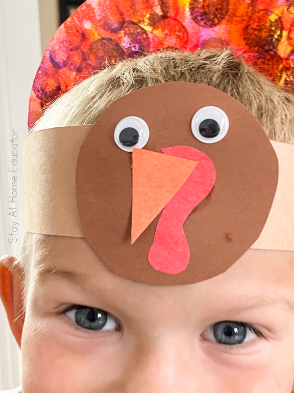 Thanksgiving hat for preschool | turkey hat | closeup of paper turkey added to hat