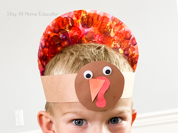 turkey hat craft for preschool | preschoolers wearing turkey hat for Thanksgiving hats, turkey craft for preschoolers