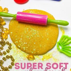 super soft playdough recipe using flour, cornstarch, chunky glitter and gold mica powder to make the gold playdough shimmer | text says super soft playdough recipe