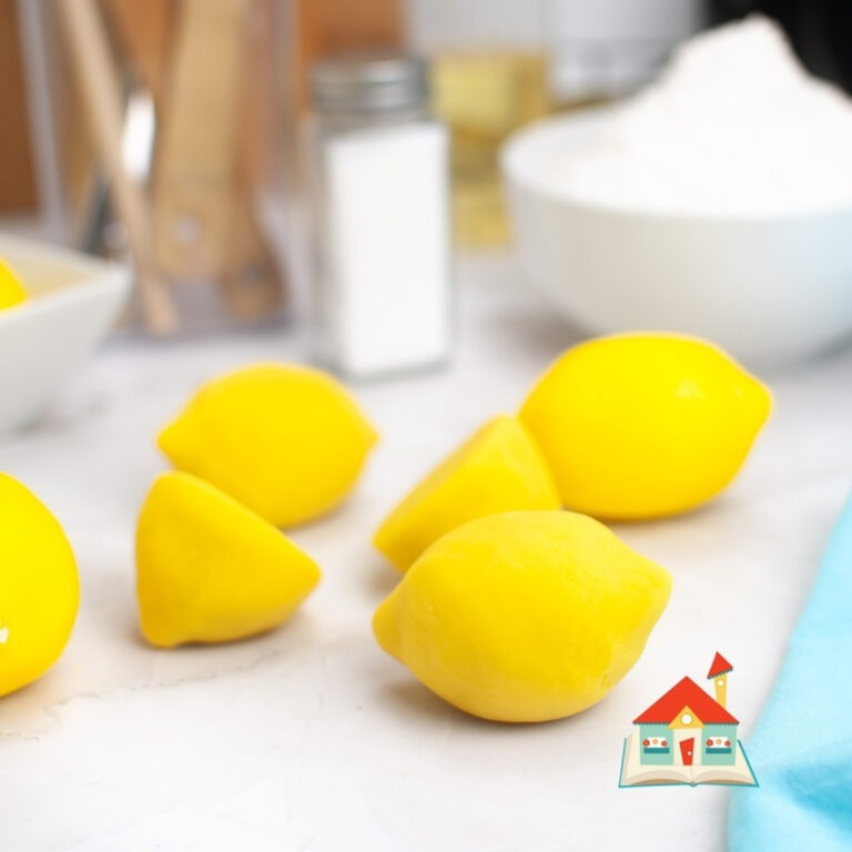 Playdough with Lemon Juice | How to make playdough using lemon juice | A playdough recipe with lemon juice instead of the traditional cream of tartar | Lemon with a blue cloth, salt, and flour.