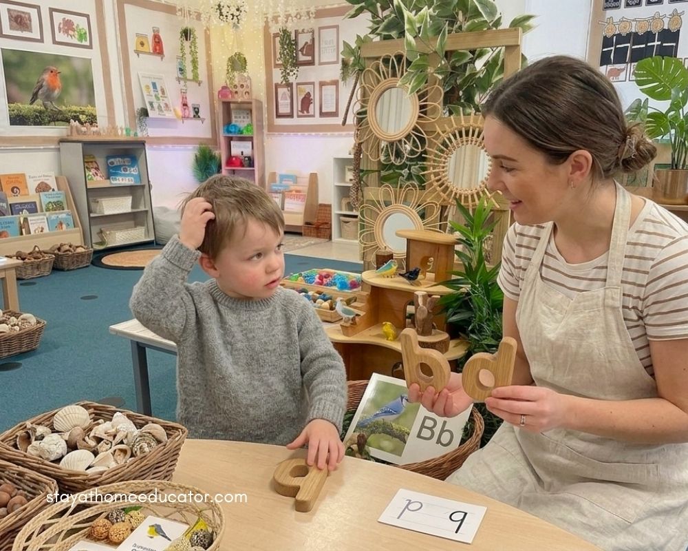 Preschool teacher guides a young child using wooden letters during a hands on phonics activity, supporting letter recognition and sound awareness with natural materials in a calm classroom setting!!!